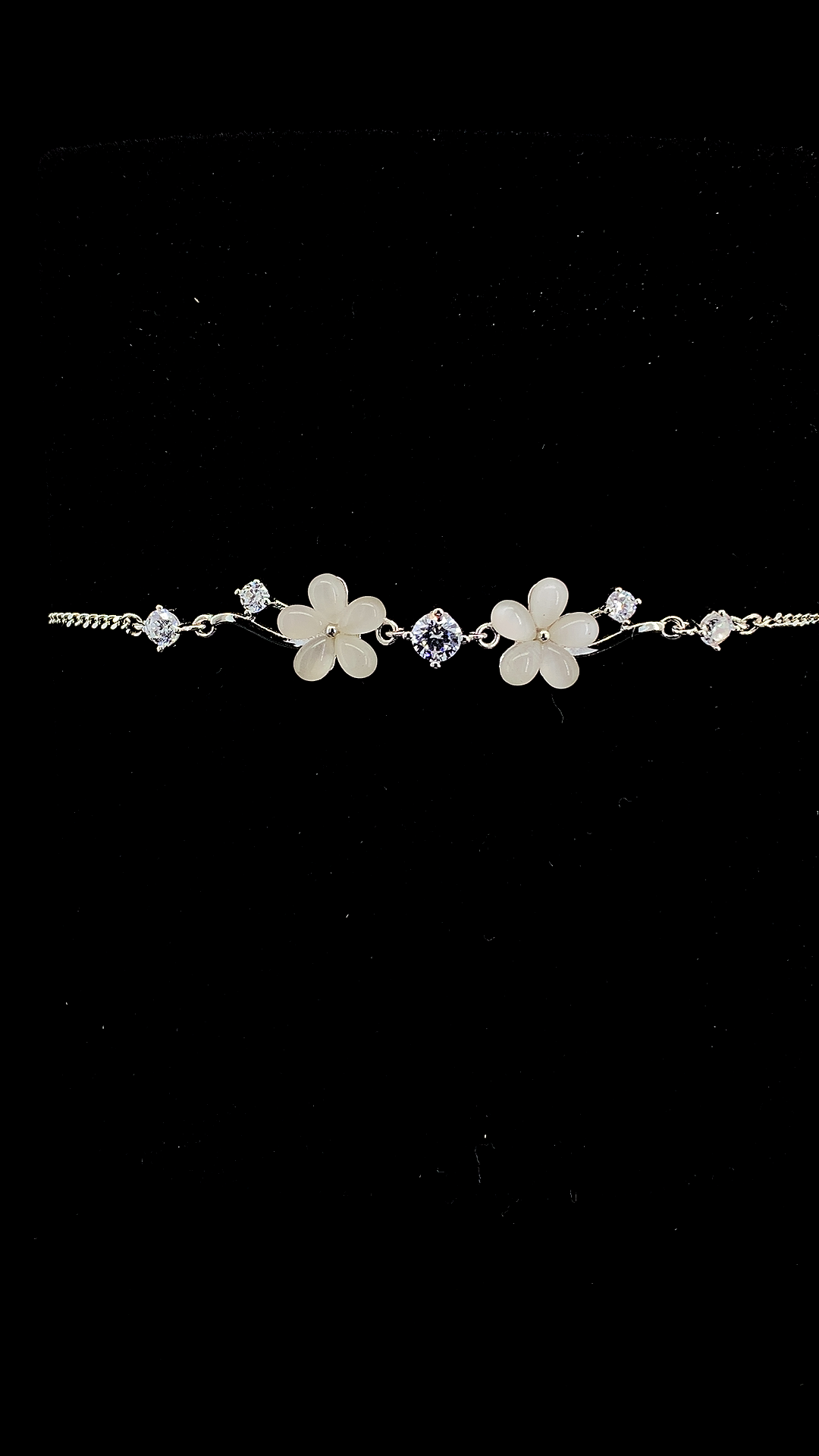 925 sterling silver Mother of Pearl five-petal flower charms and round CZ solitaire station bracelet on curb chain — The Blossom & Sparkle Bracelet by The White Kala
