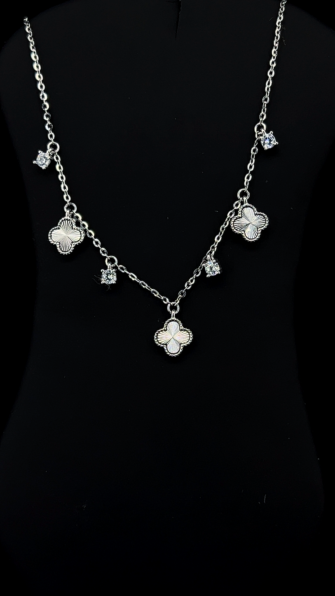 925 sterling silver Quatrefoil Garland necklace with engraved clover charms and white Cubic Zirconia solitaire drops by The White Kala