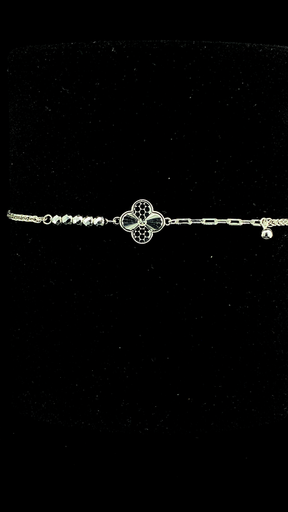 925 sterling silver asymmetric bracelet with engraved quatrefoil clover charm, faceted bead chain and paperclip chain with ball drop — The Clover Asymmetric Bracelet by The White Kala