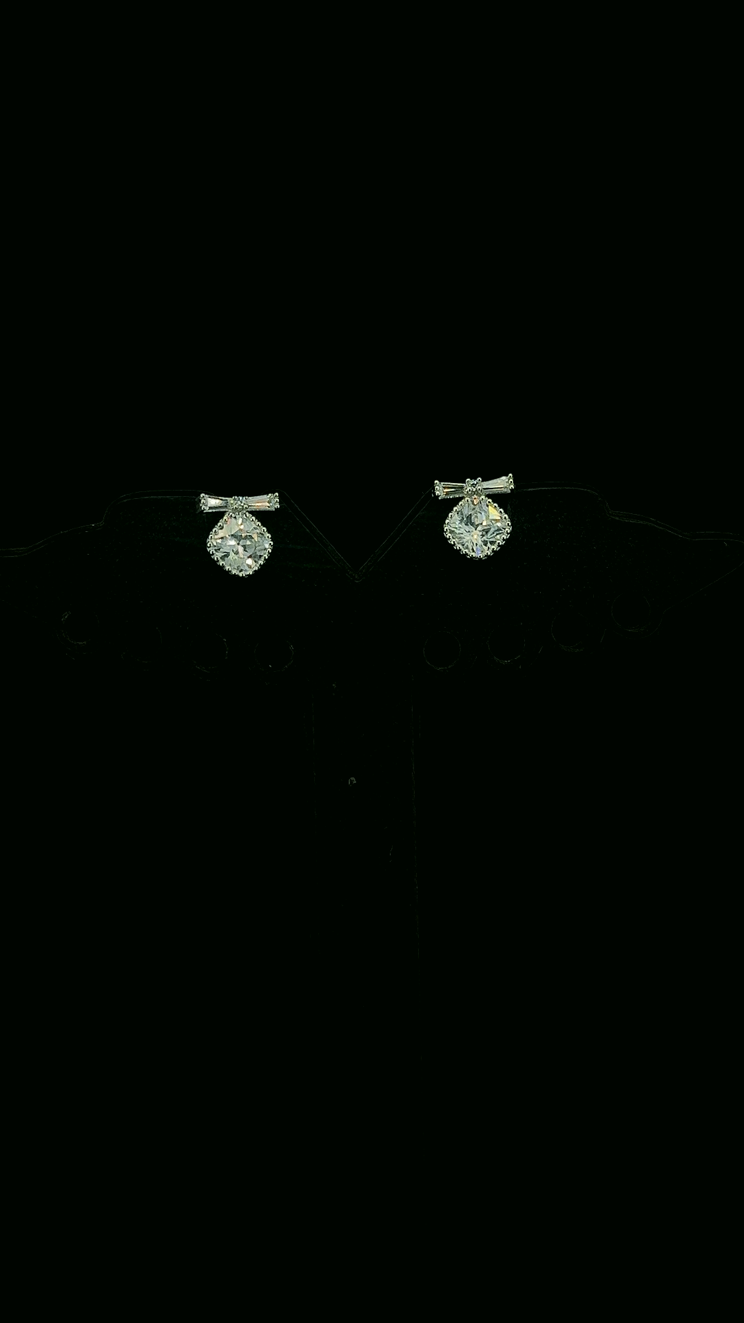 925 sterling silver baguette CZ bow stud earrings with round CZ micropavé ball drop — The Bow Drop Stud by The White Kala