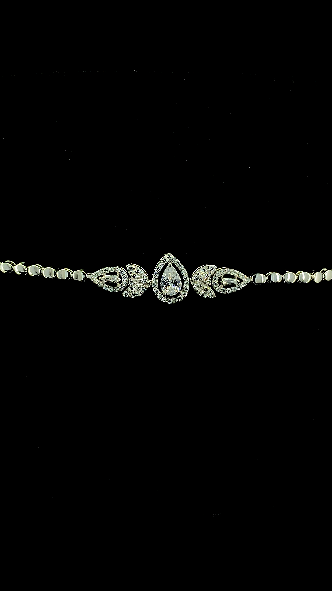 925 sterling silver pear CZ halo and marquise baguette leaf cluster centrepiece bracelet on oval link chain — The Petal Crown Bracelet by The White Kala