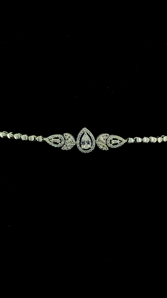 925 sterling silver pear CZ halo and marquise baguette leaf cluster centrepiece bracelet on oval link chain — The Petal Crown Bracelet by The White Kala