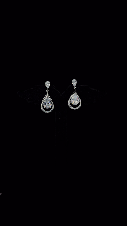 925 sterling silver pear CZ stud and open teardrop micropavé frame drop earrings with floating pear CZ solitaire — The Dewdrop by The White Kala
