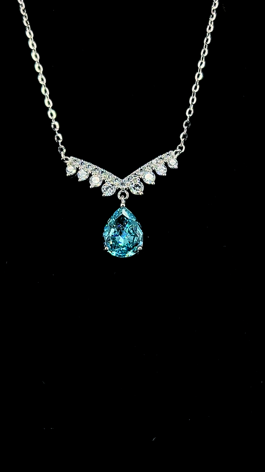 Blue pear-shaped Cubic Zirconia teardrop necklace with white CZ crown bar in BIS Hallmarked 925 sterling silver by The White Kala