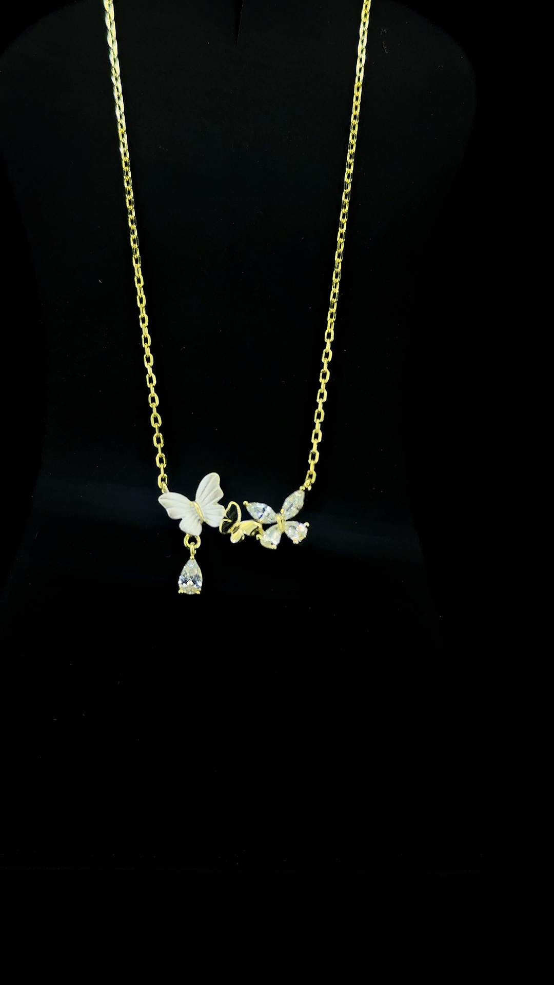 Gold plated 925 sterling silver butterfly necklace with Mother of Pearl and Cubic Zirconia butterflies and teardrop CZ drop — The Golden Flutter by The White Kala
