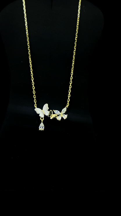 Gold plated 925 sterling silver butterfly necklace with Mother of Pearl and Cubic Zirconia butterflies and teardrop CZ drop — The Golden Flutter by The White Kala
