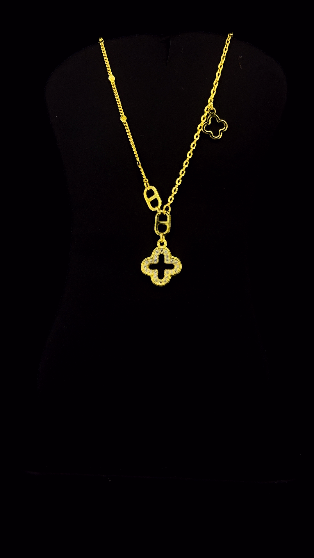 Gold plated 925 sterling silver open quatrefoil clover pendant necklace with white CZ micropavé and asymmetric clover charm — The Golden Clover by The White Kala