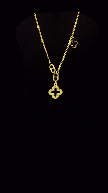 Gold plated 925 sterling silver open quatrefoil clover pendant necklace with white CZ micropavé and asymmetric clover charm — The Golden Clover by The White Kala
