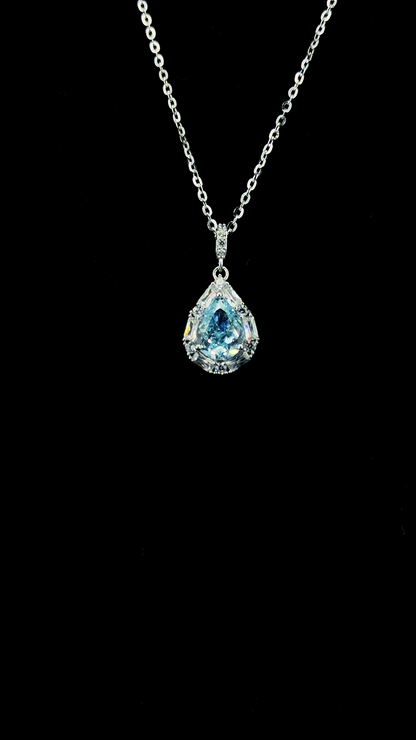 Large blue pear-shaped Cubic Zirconia teardrop pendant chain with white CZ baguette halo in BIS Hallmarked 925 sterling silver — The Azure Drop by The White Kala
