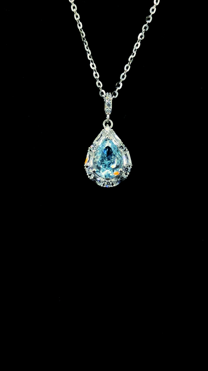 Large blue pear-shaped Cubic Zirconia teardrop pendant chain with white CZ baguette halo in BIS Hallmarked 925 sterling silver — The Azure Drop by The White Kala