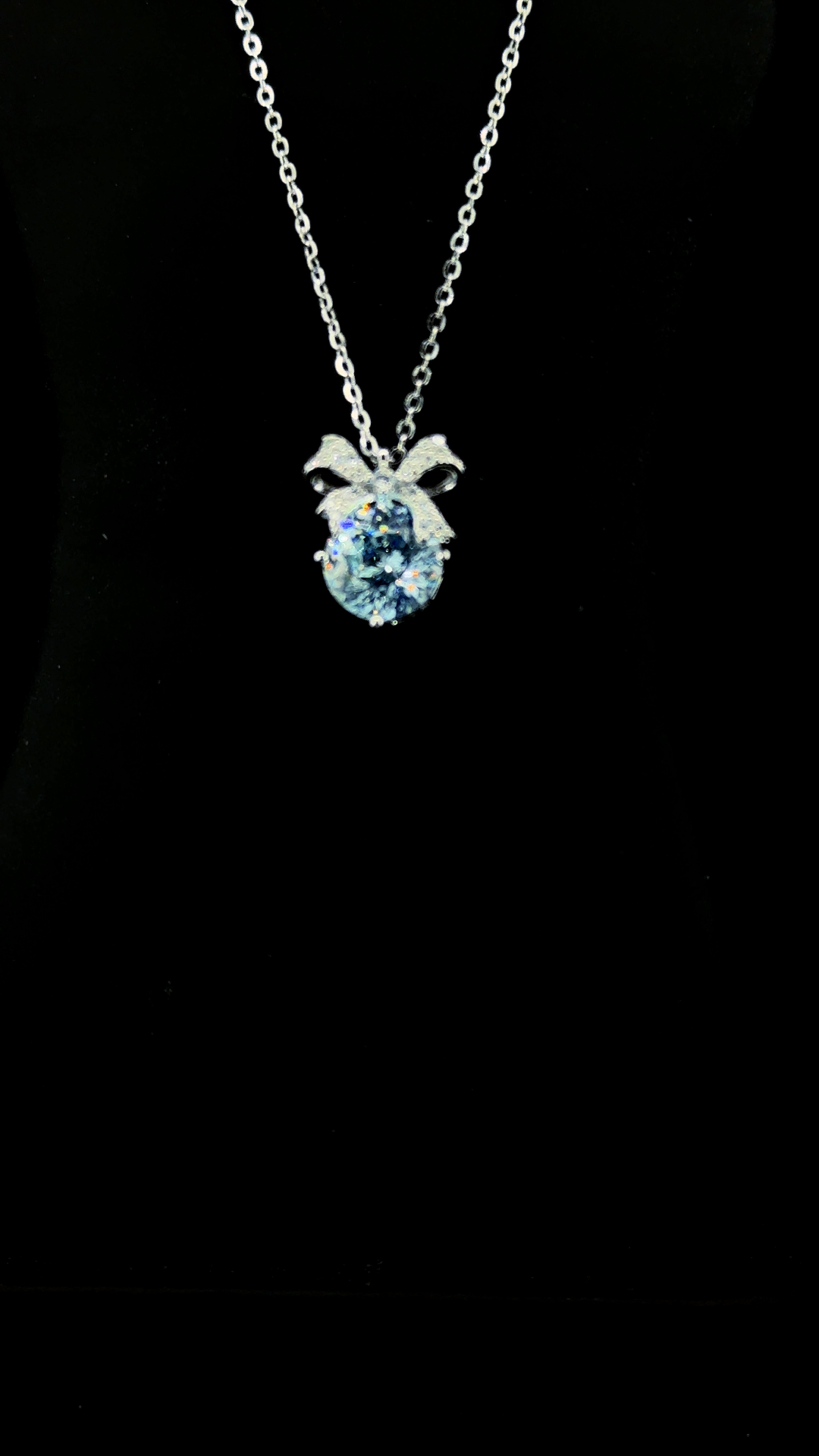 Sky blue oval Cubic Zirconia pendant chain with sterling silver bow bail in BIS Hallmarked 925 sterling silver — The Blue Bow by The White Kala