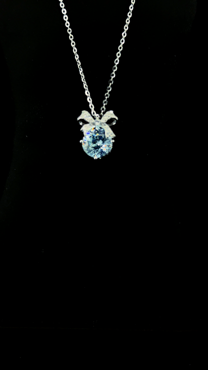 Sky blue oval Cubic Zirconia pendant chain with sterling silver bow bail in BIS Hallmarked 925 sterling silver — The Blue Bow by The White Kala