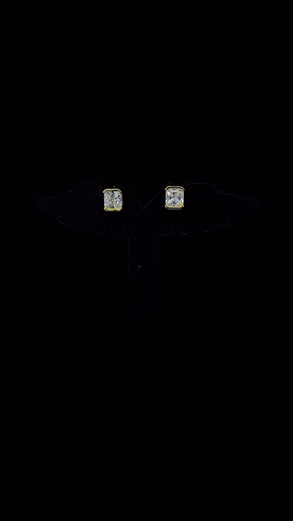 Pair of radiant cut stud earrings in 925 sterling silver bezel setting.