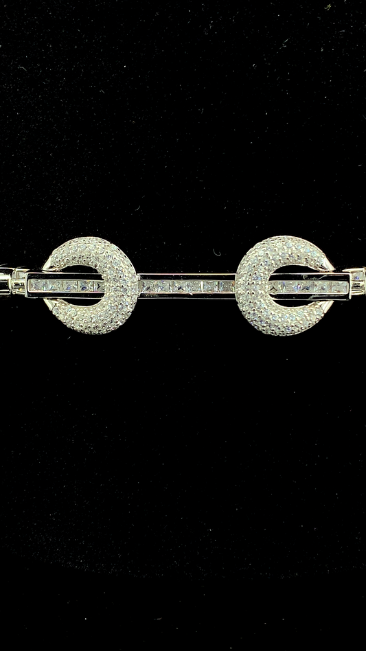 925 sterling silver bracelet featuring a sparkling cubic zirconia straight bar passing through two crystal-studded circles on a black background.